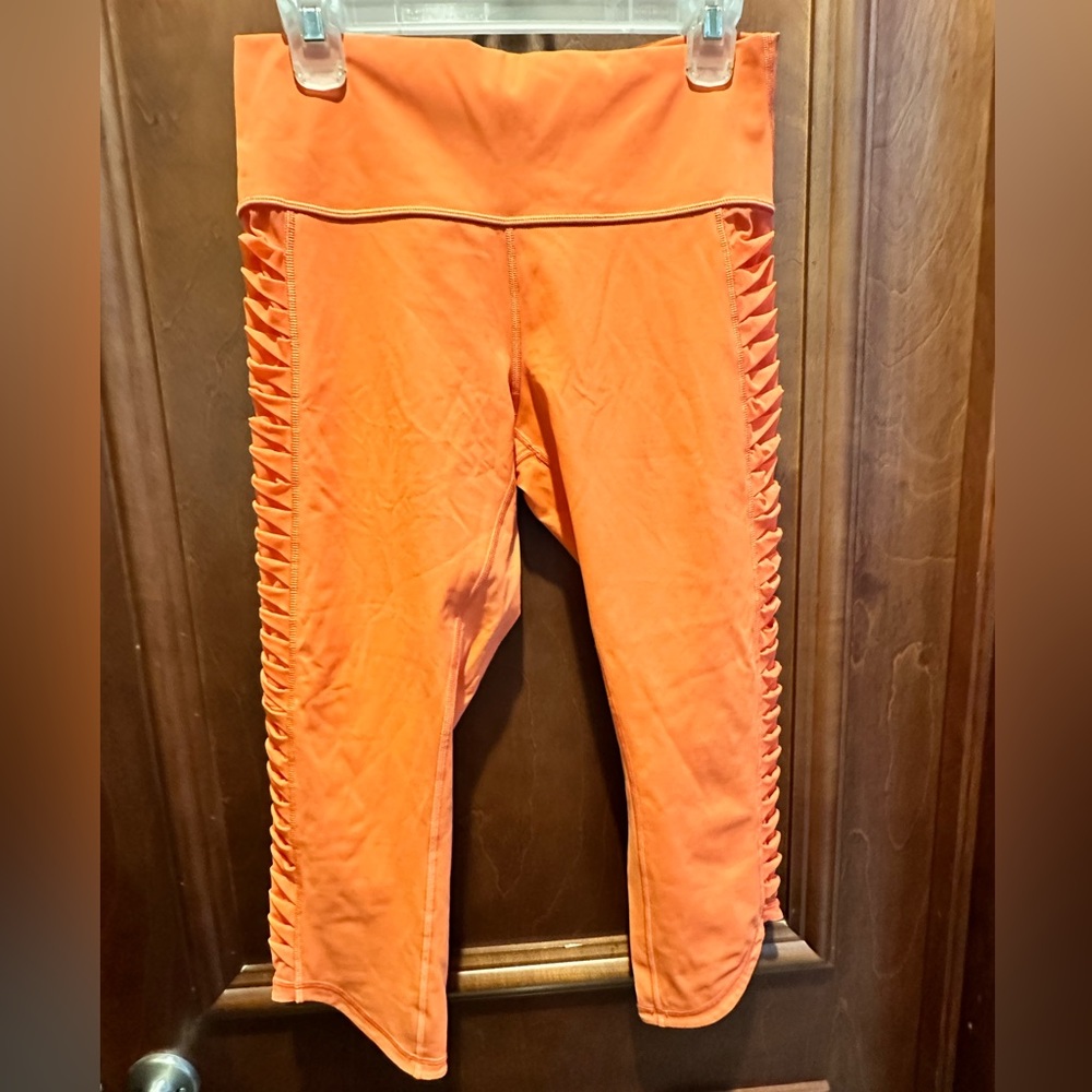 Lululemon size 10 cropped leggings. Orange